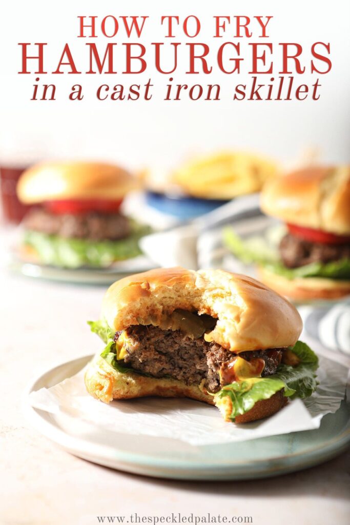 A burger with a bite taken out of it on a plate with the text how to fry hamburgers in a cast iron skillet