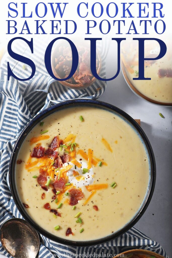 A bowl of potato soup garnished with cheese, sour cream, bacon and chives with the text slow cooker baked potato soup