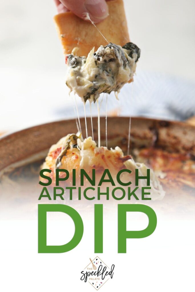 A pita chip scoops up hot dip with the text Spinach Artichoke Dip