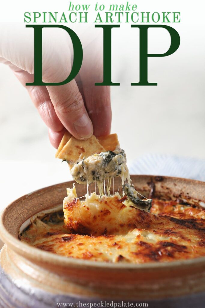 A pita chip scoops up hot spinach dip with the text how to make Spinach Artichoke Dip