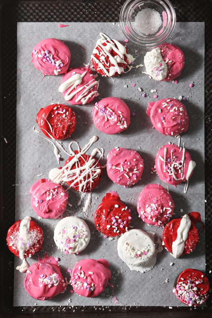 A baking sheet of decorated Oreo Valentines