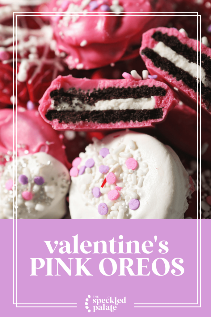 Red, white and pink Oreos stacked on a baking sheet with the text valentine's pink oreos