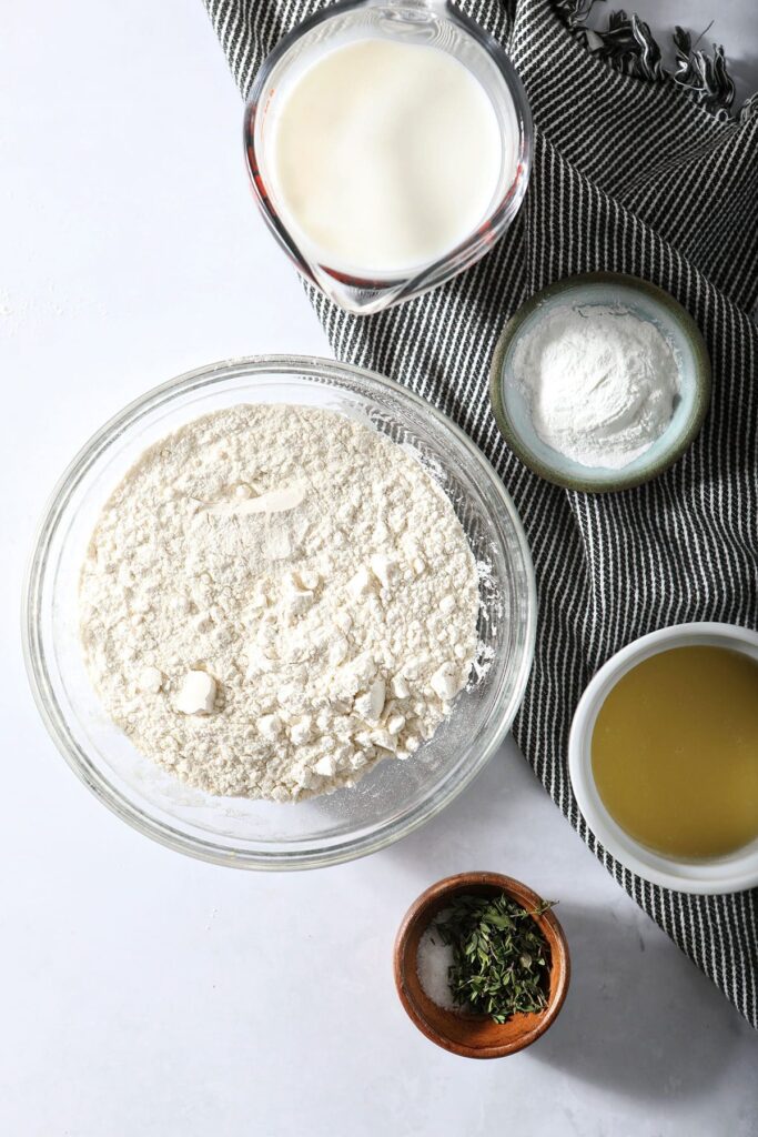 Ingredients to make herb dumplings in bowls