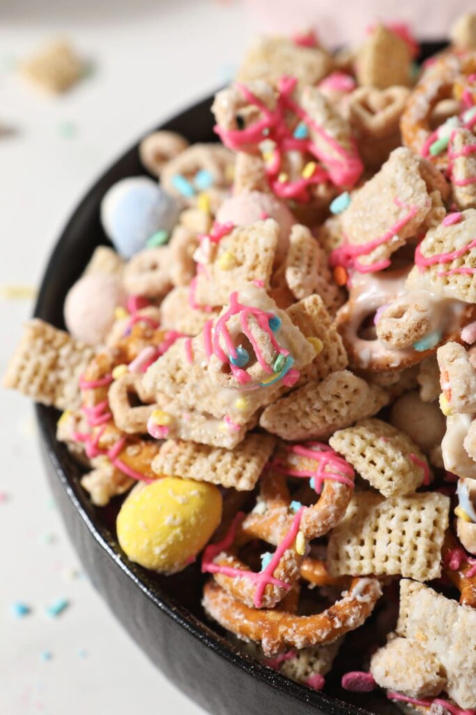 Close up of Easter Snack Chex Mix in a black bowl