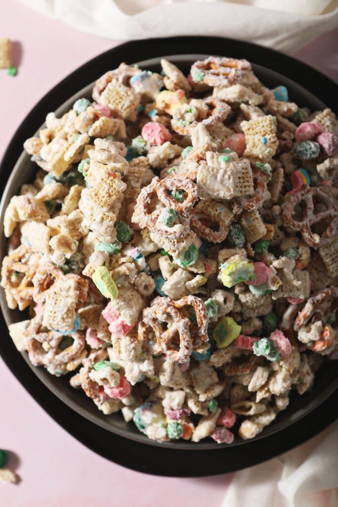 A bowl of St. Patrick's Day Snack Mix on a black plate