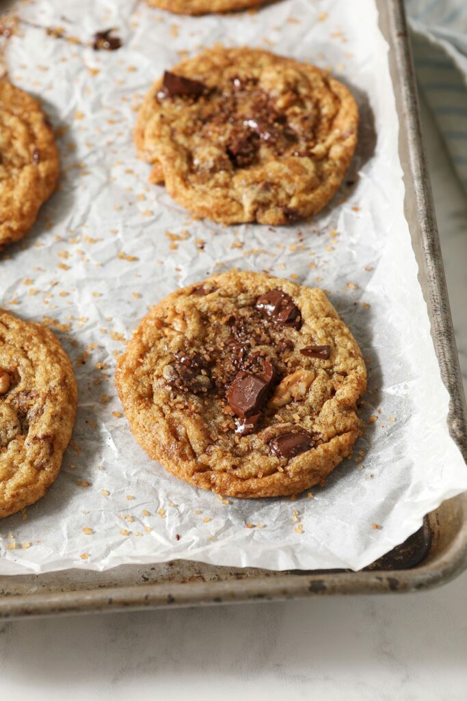 Browned Butter Chocolate Chip Cookies with Walnuts and Bourbon on a baking sheet