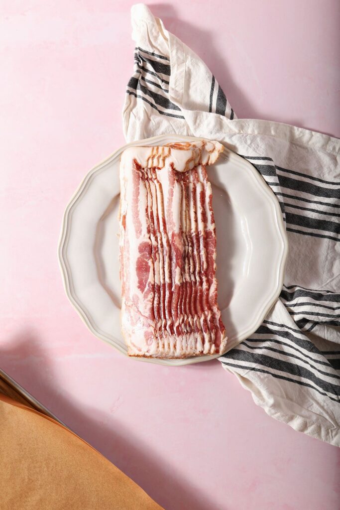 Raw bacon on a plate