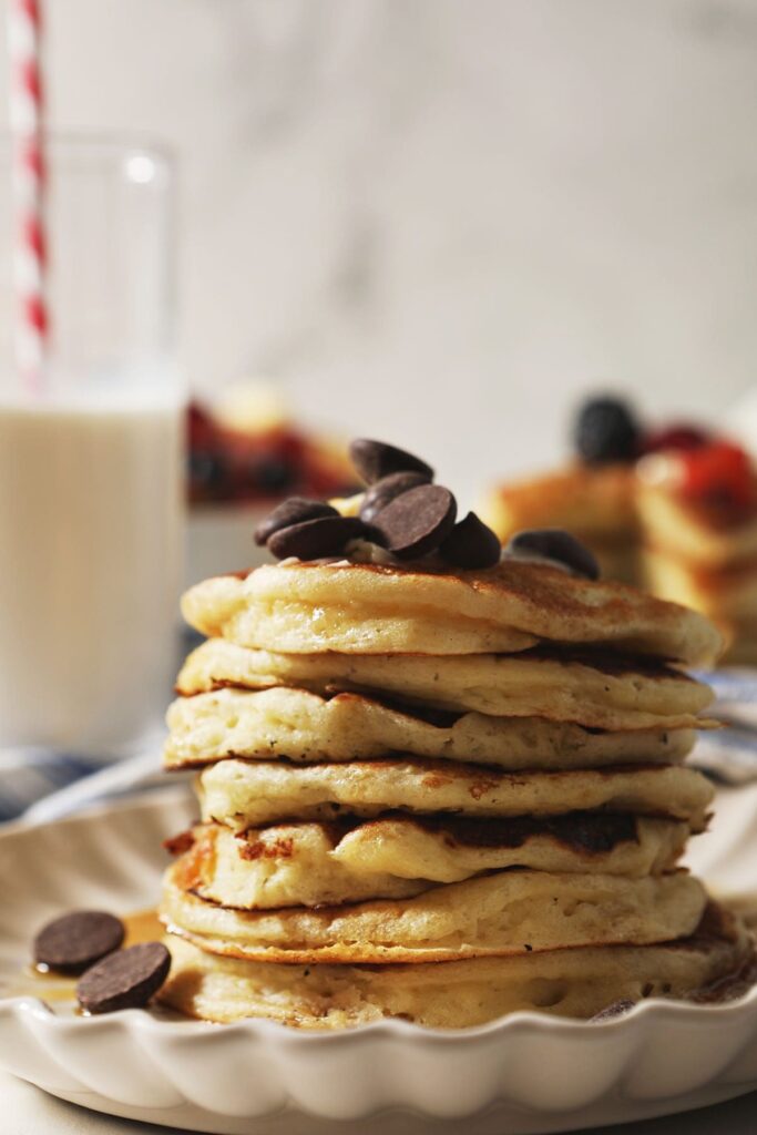 Close up of a stack of buttermilk pancakes with chocolate chips