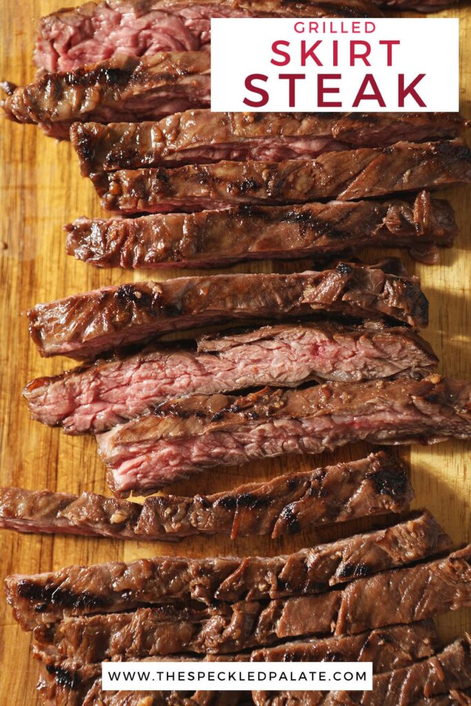 Sliced steak on a wood cutting board with the text grilled skirt steak