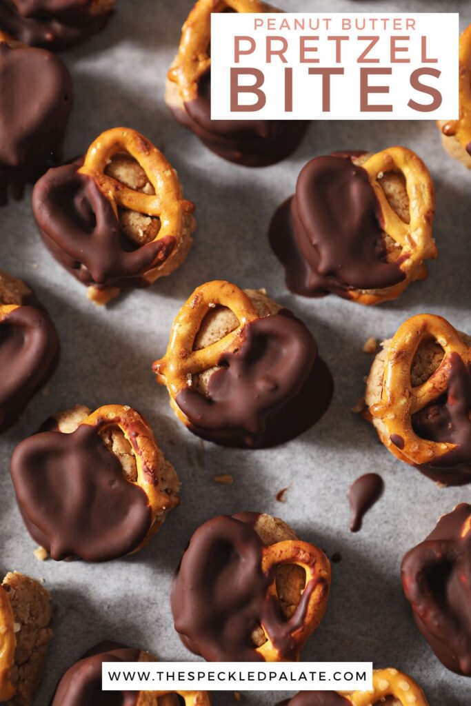 Peanut butter chocolate pretzels on a sheet pan with the text peanut butter pretzel bites