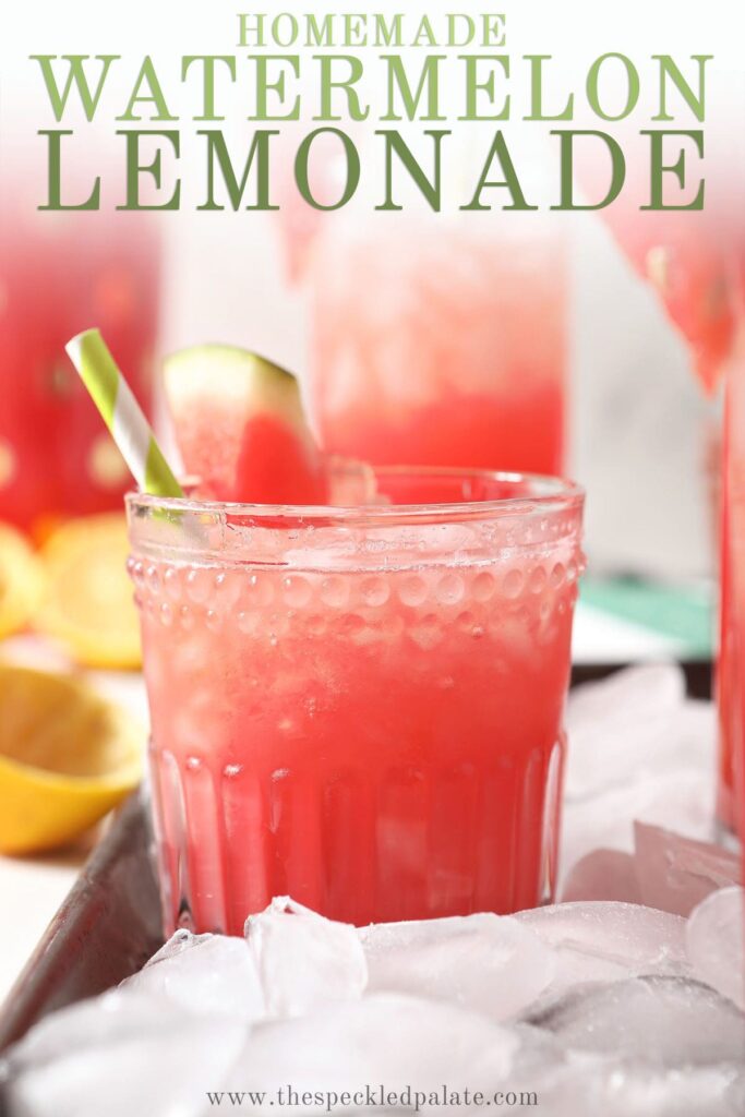 Close up of a glass of a watermelon drink surrounded by ice with the text homemade watermelon lemonade