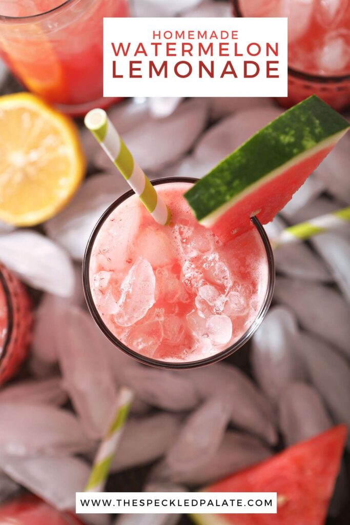 Overhead of a glass of a pink drink surrounded by ice with the text homemade watermelon lemonade