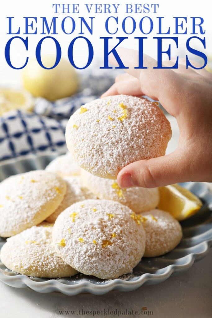 A child holds a Lemon Cooler Cookie in front of a plate with the text the very best lemon cooler cookies