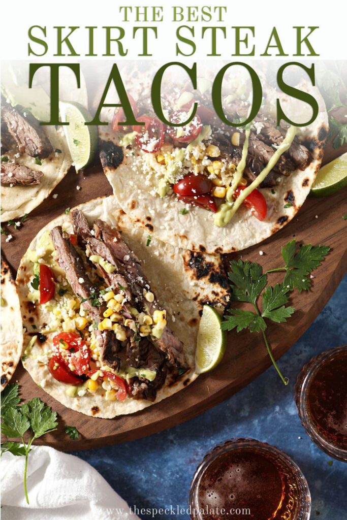 Three skirt steak tacos on a wooden board next to a cup of beer with the text the best skirt steak tacos