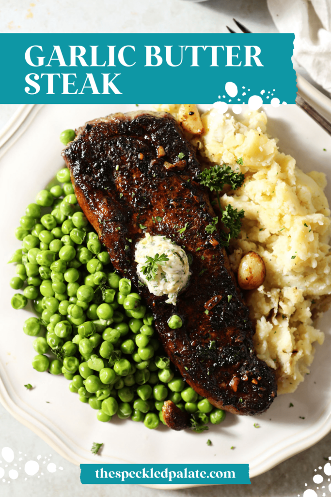 Sliced steak on a plate with peas and mashed potatoes with the text garlic butter steak