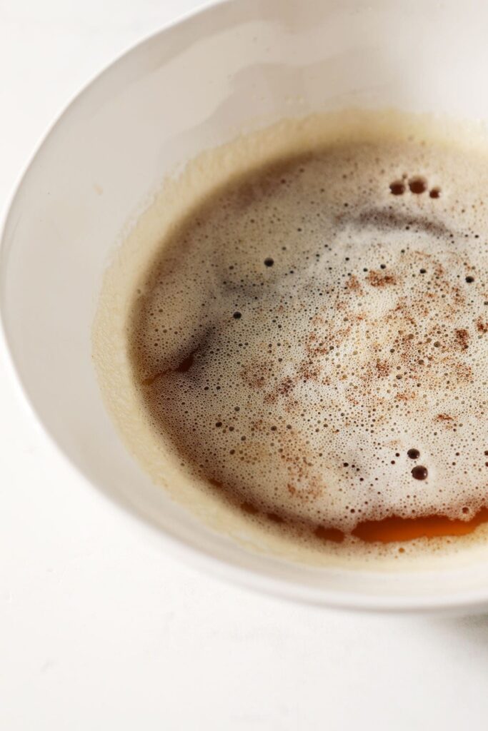 Close up of a white bowl of browned butter