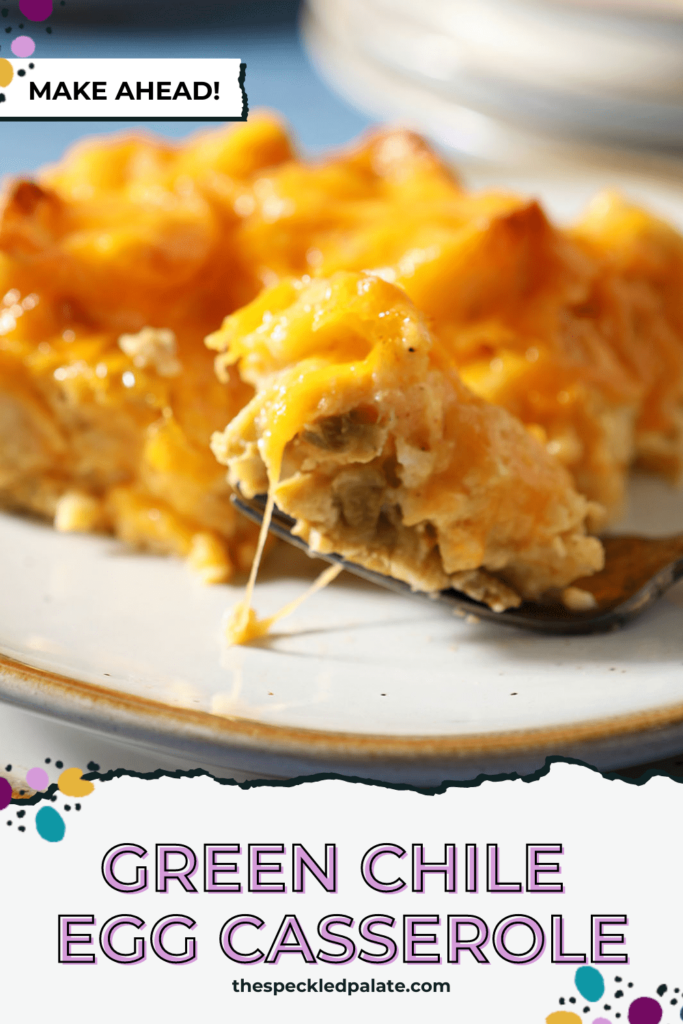 A fork holds a bite of an egg casserole on a plate with the text green Chile egg casserole