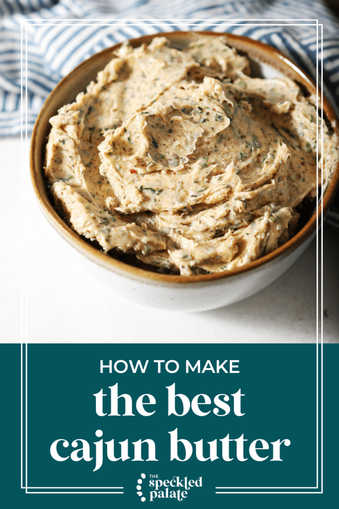 Compound Butter in a white bowl with a brown rim on marble next to a blue hatched towel and herbs with the text How to Make the Best Cajun Butter