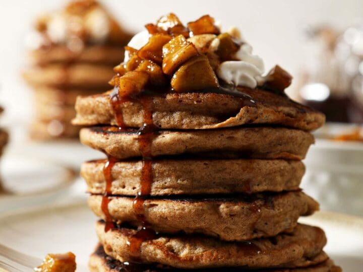Close up of syrup dripping down the side of a stack of Apple Cider Pancakes