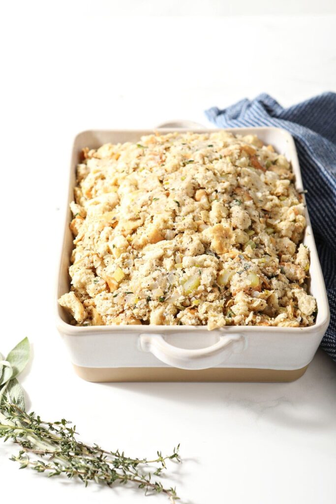 Sage stuffing in a casserole dish before baking