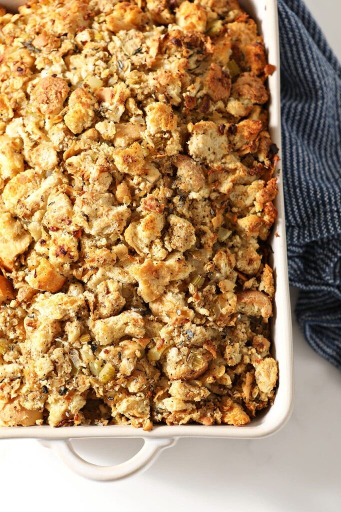 A casserole dish of golden brown stuffing