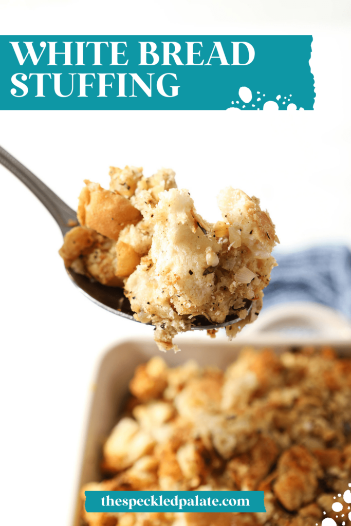 A spoon holds a serving of sage stuffing above a casserole dish