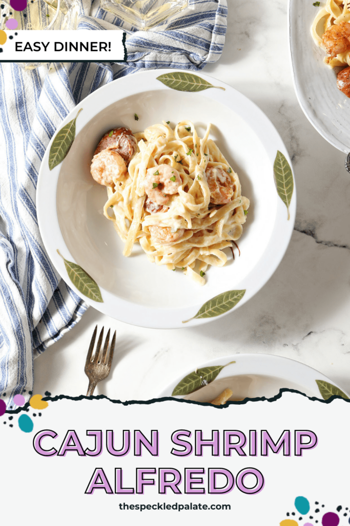 A bowl of Shrimp Fettuccine Alfredo on marble with the text Cajun Shrimp Alfredo