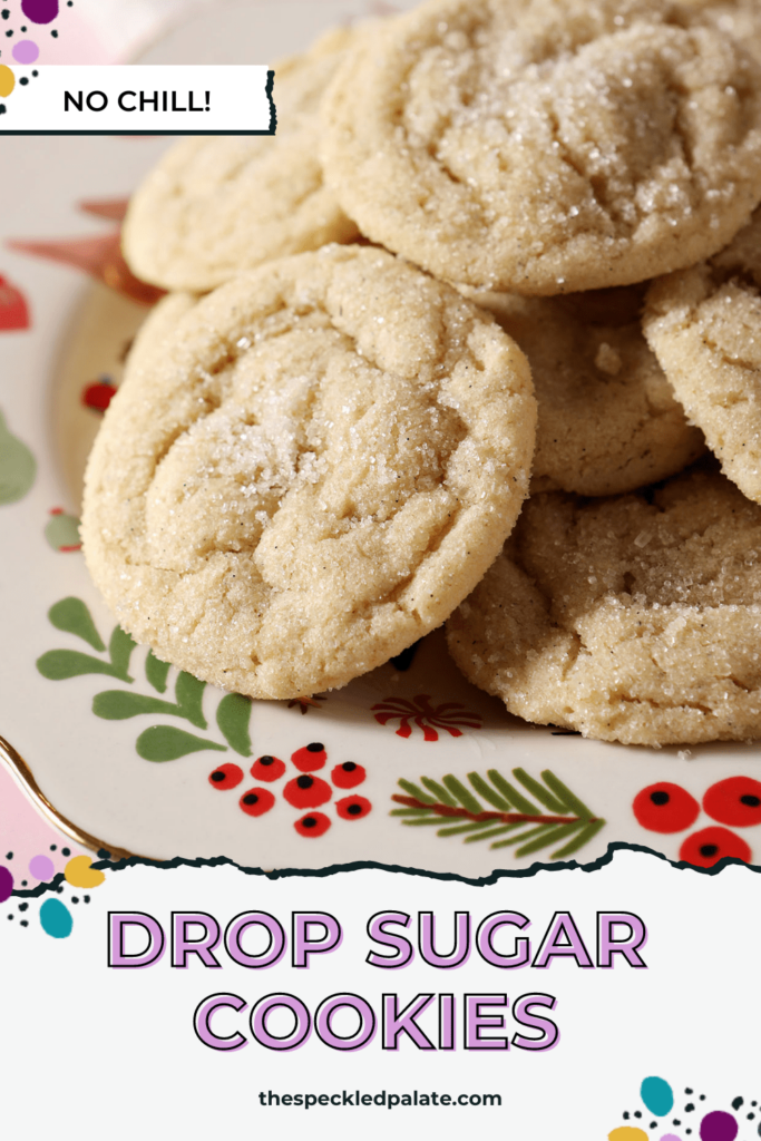 A Christmas platter of round Sugar Cookies on a pink countertop with the text Drop Sugar Cookies