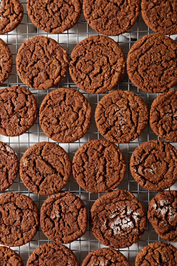 Gingersnap cookies cooling on a wire rack