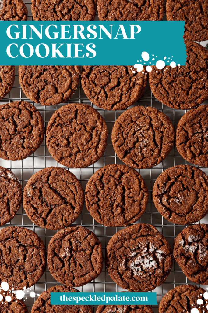 Gingersnap cookies cooling on a wire rack with the text gingersnap cookies