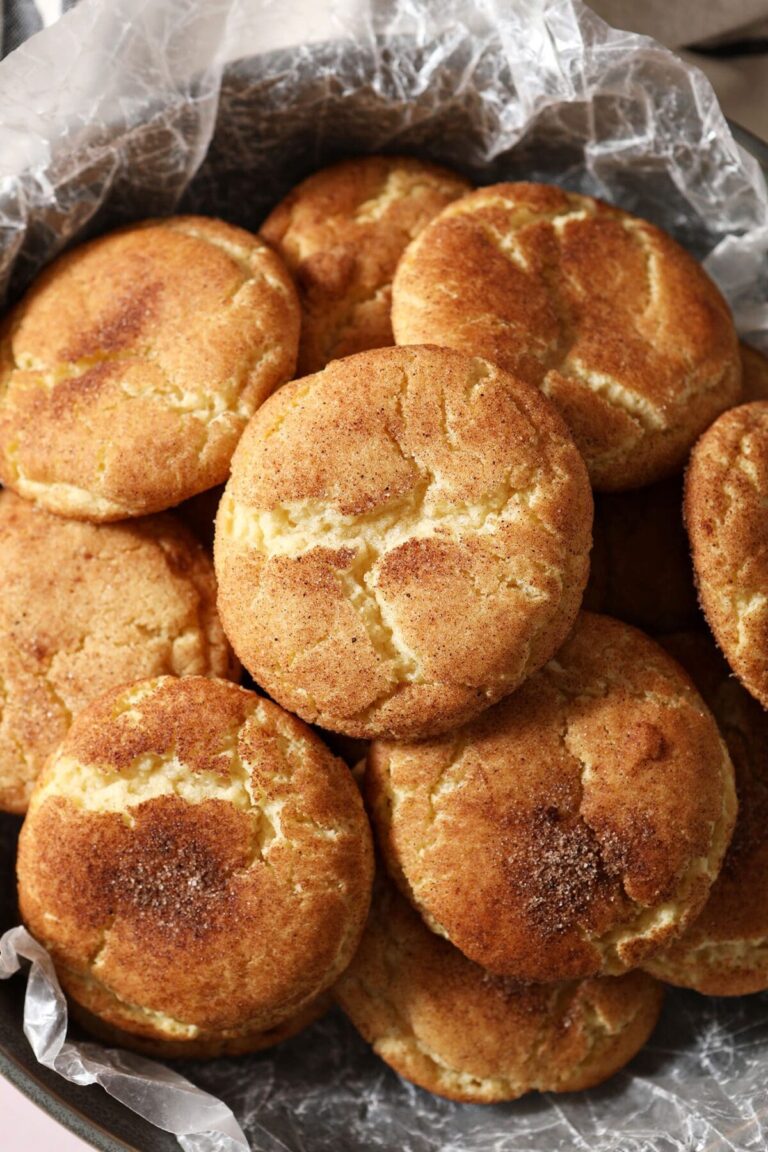 Close up of snickerdoodle cookies stacked in a bowl