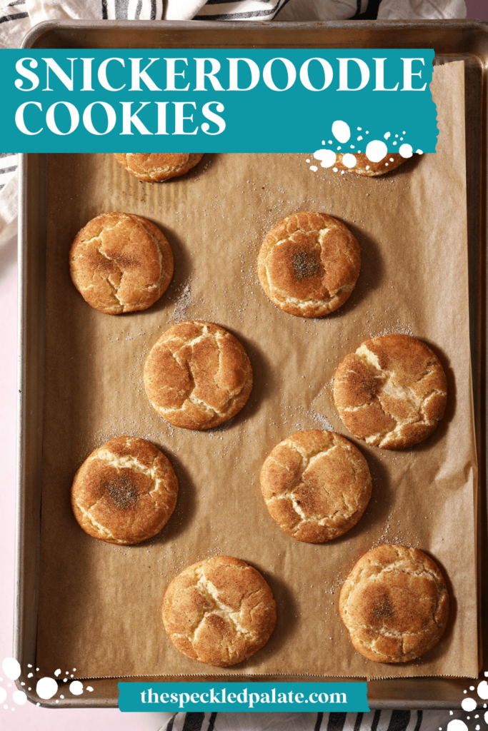 Crackly snickerdoodle cookies on a baking sheet with the text Snickerdoodle Cookies