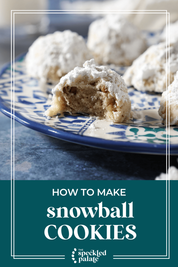 A bitten into cookie covered in powdered sugar on a blue plate with the text how to make snowball cookies