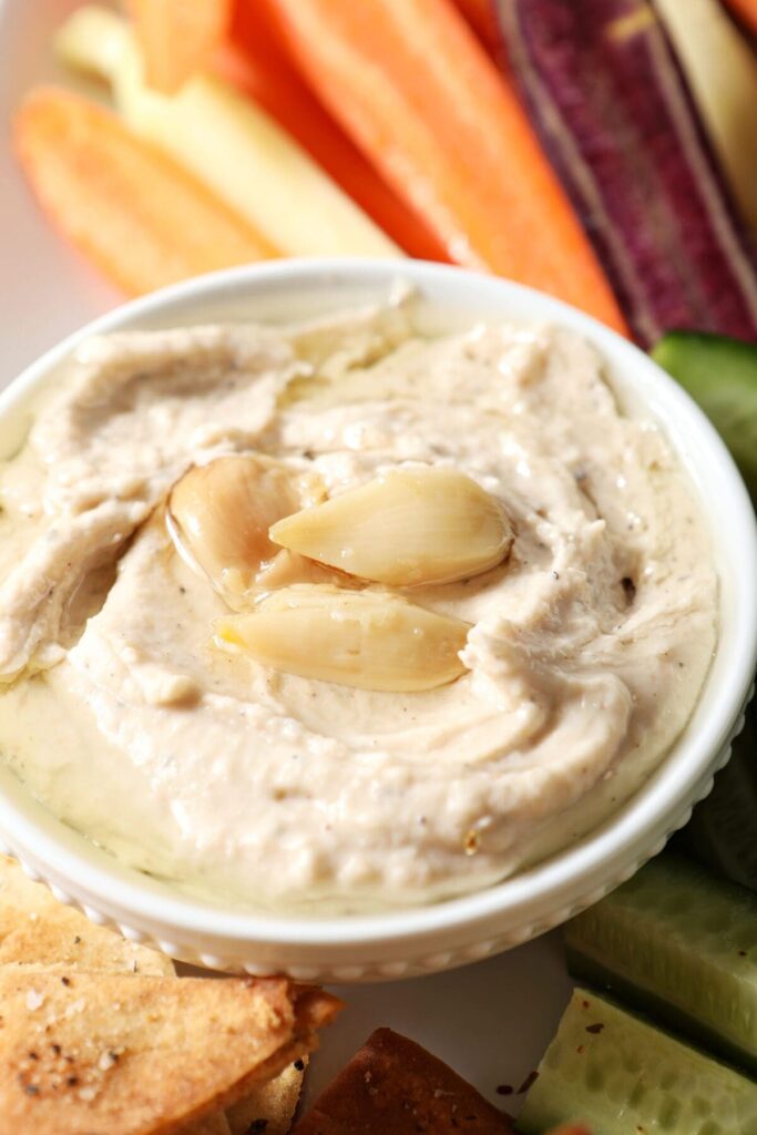 Close up of a serving bowl of Roasted Garlic White Bean Hummus