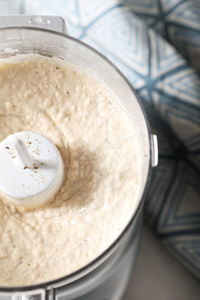 Smooth Roasted Garlic White Bean Hummus in a food processor after blending