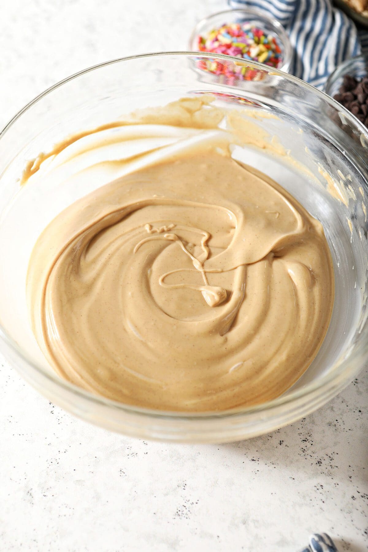 The peanut butter-white chocolate mixture in a large bowl on marble