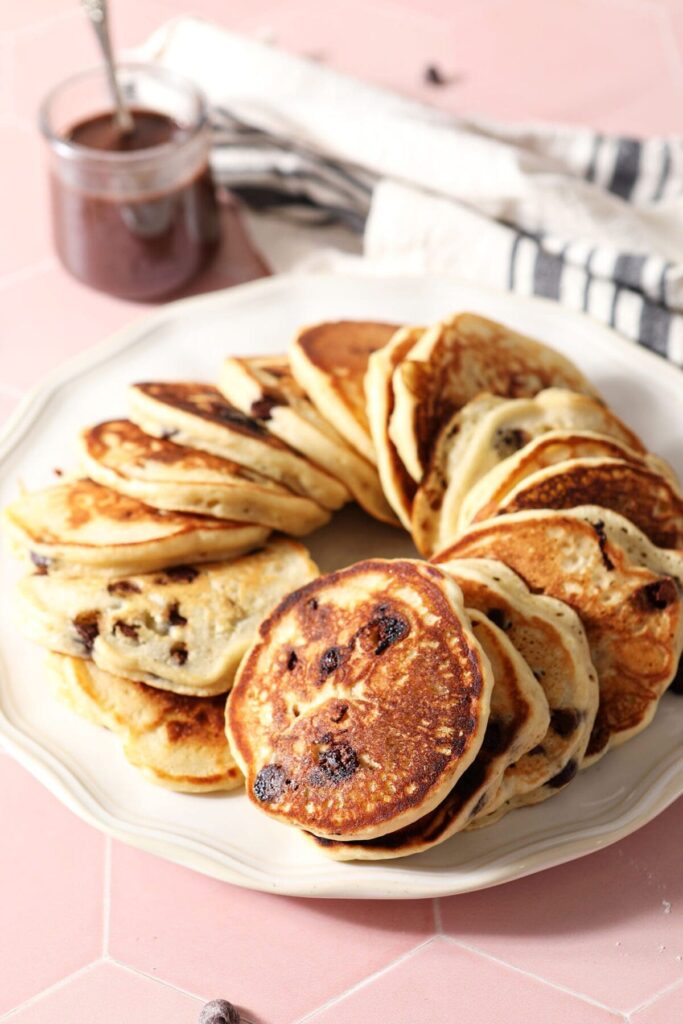 A plate of Chocolate Chip Pancakes arranged in a circular shape