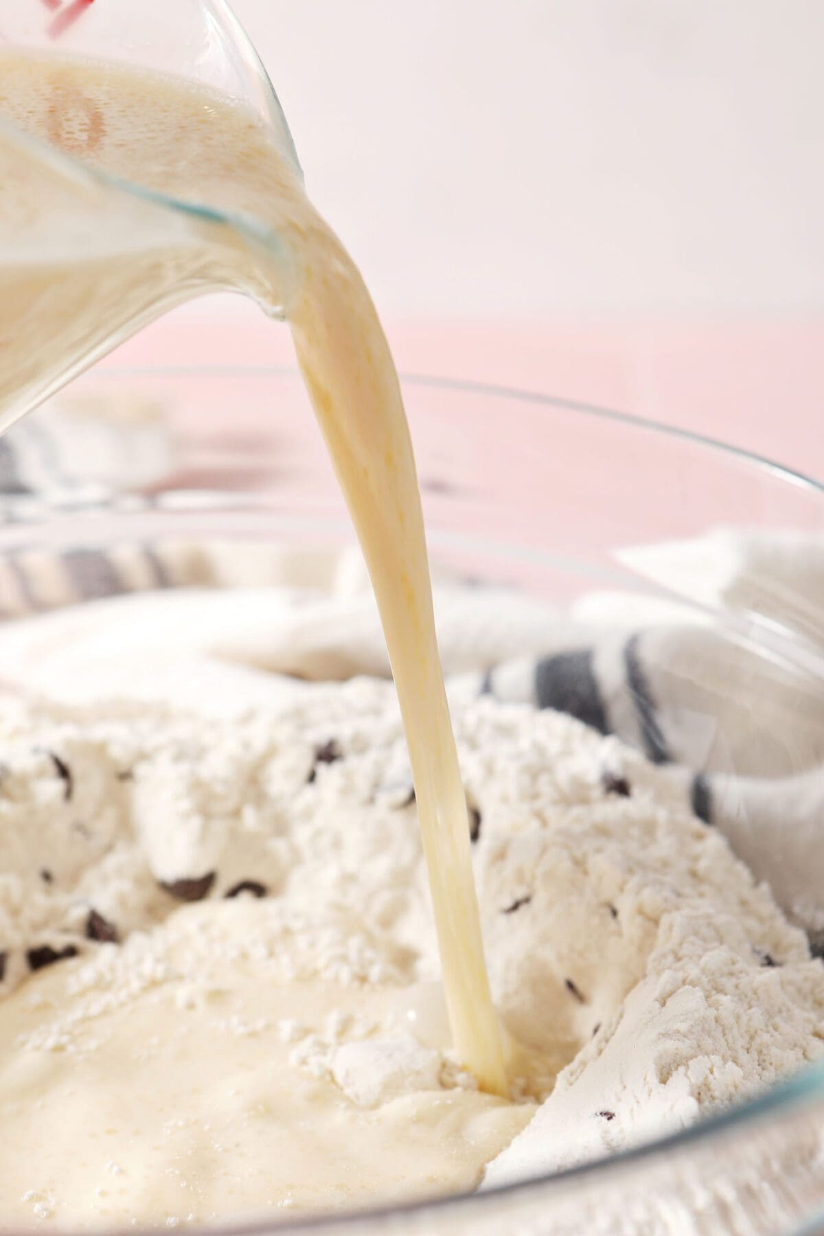 The milk mixture pours into the dry ingredients