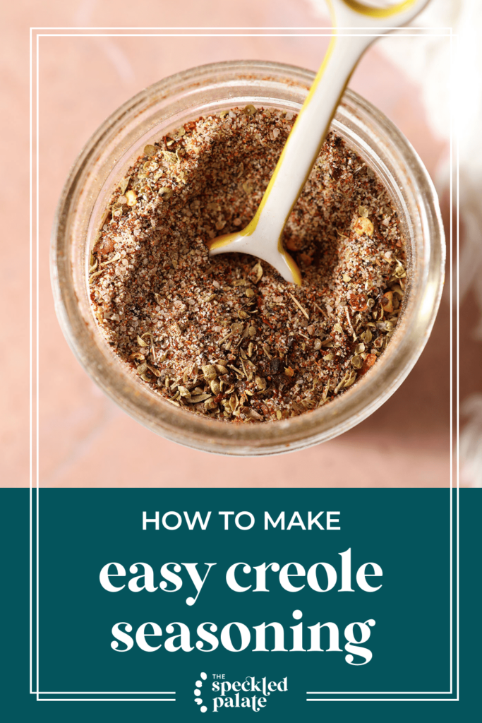 Closeup of a teaspoon in a homemade spice blend with the text how to make easy creole seasoning