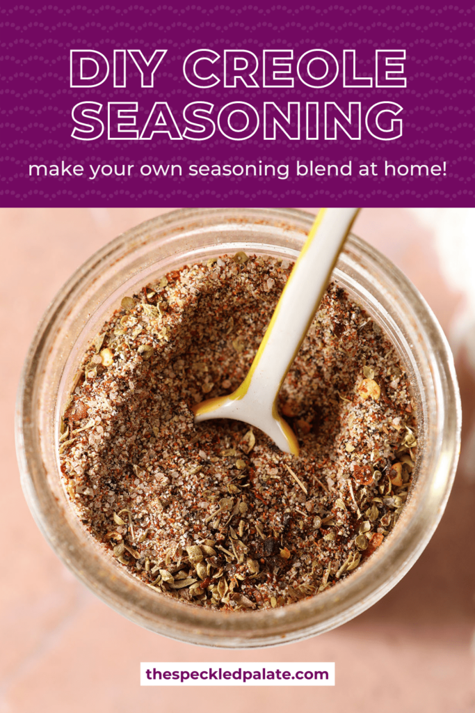 Closeup of a teaspoon in a homemade spice blend with the text DIY Creole Seasoning make your own seasoning blend at home