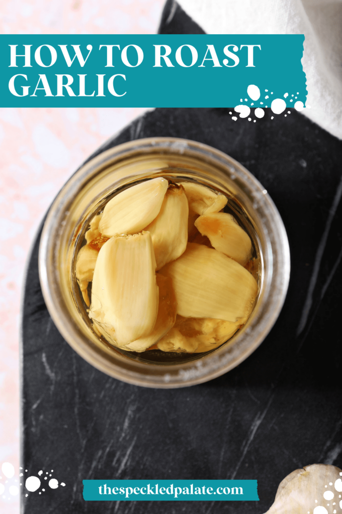 Roasted garlic cloves in a jar with a spoon and oil with the text how to roast garlic