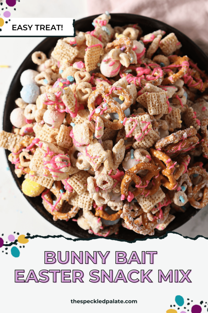 A bowl of sweet and salty chex mix on marble with a pink linen with the text Bunny Bait Easter Snack Mix