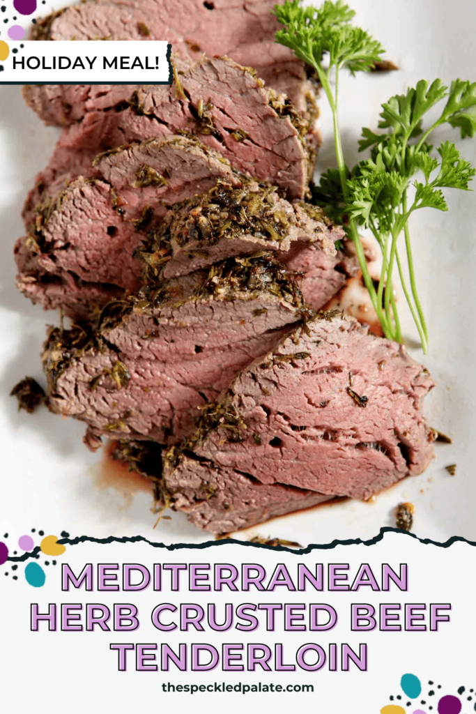 A close up of the sliced beef tenderloin on a white plate with the text Mediterranean Herb Crusted Beef Tenderloin