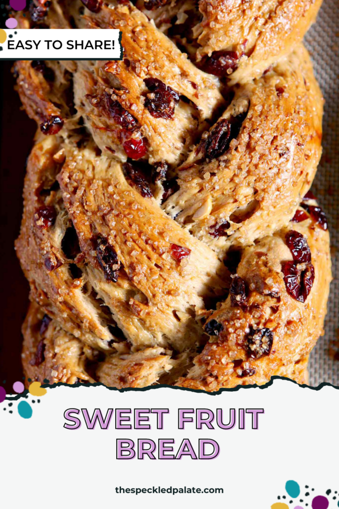 Overhead close up of fruit studded holiday bread with the text sweet fruit bread