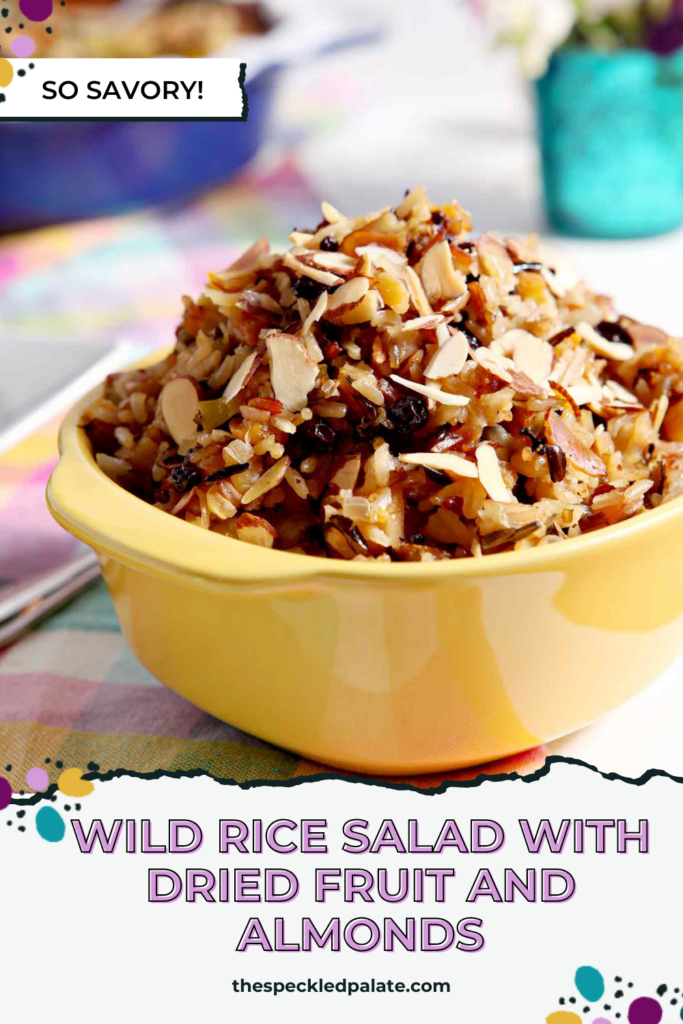 wild rice salad in a yellow bowl with the text Wild Rice Salad with Dried Fruit and Almonds