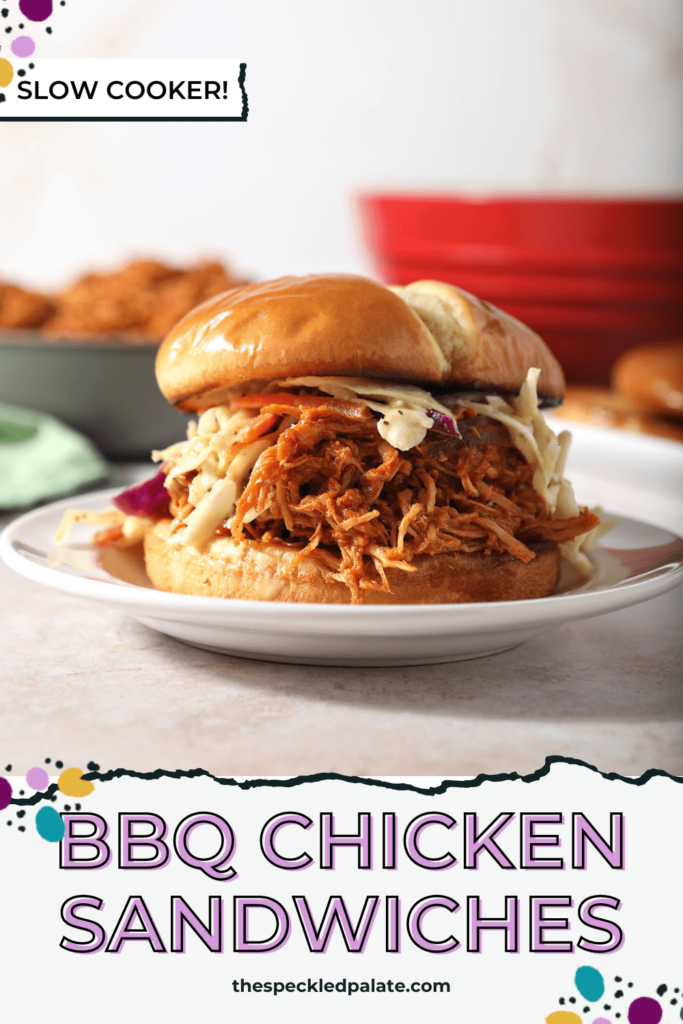 A pulled BBQ chicken sandwiches on a plate with slaw with the text BBQ chicken sandwiches