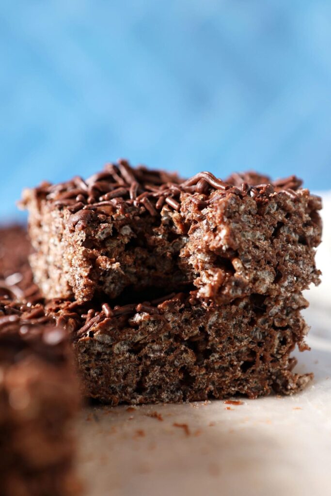 A bitten-into Chocolate Rice Krispie Treats stacked on top of another