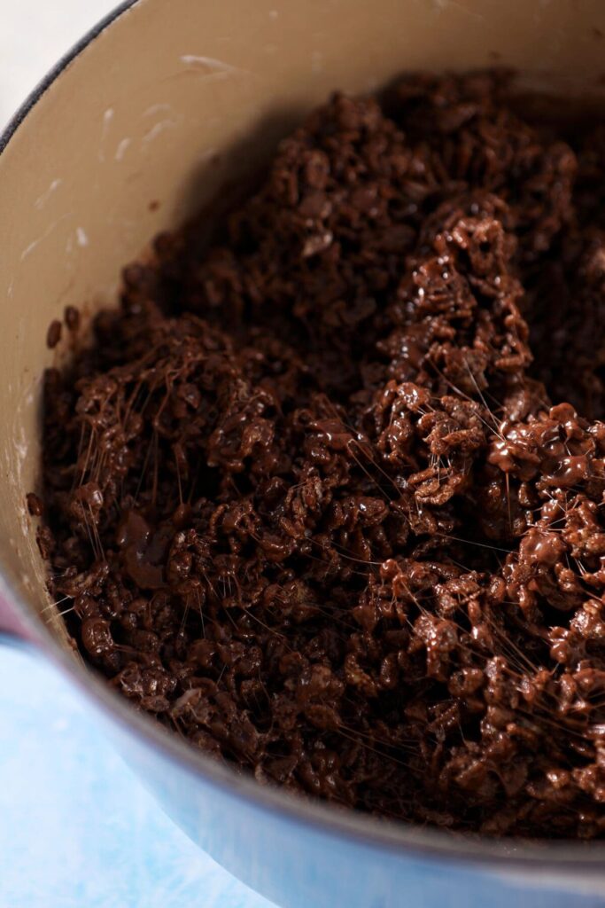 Homemade Chocolate Rice Krispie Treats are the best no bake dessert for any chocolate lover. All you need are 6 simple ingredients to make these chocolate krispie rice treats. Learn how to make them your own here! Makes 24 treats. 

Chocolate Rice Krispie Treat batter in a dutch oven before pouring into a pan