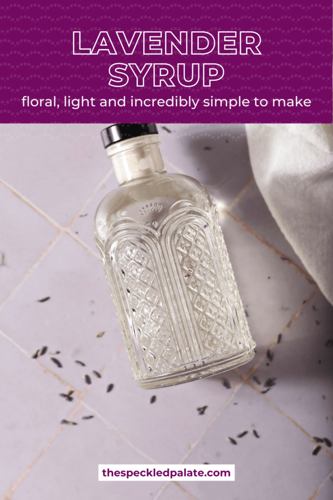 A bottle of simple syrup on a purple lies on purple tile with the text Lavender Syrup floral, light and incredibly simple to make