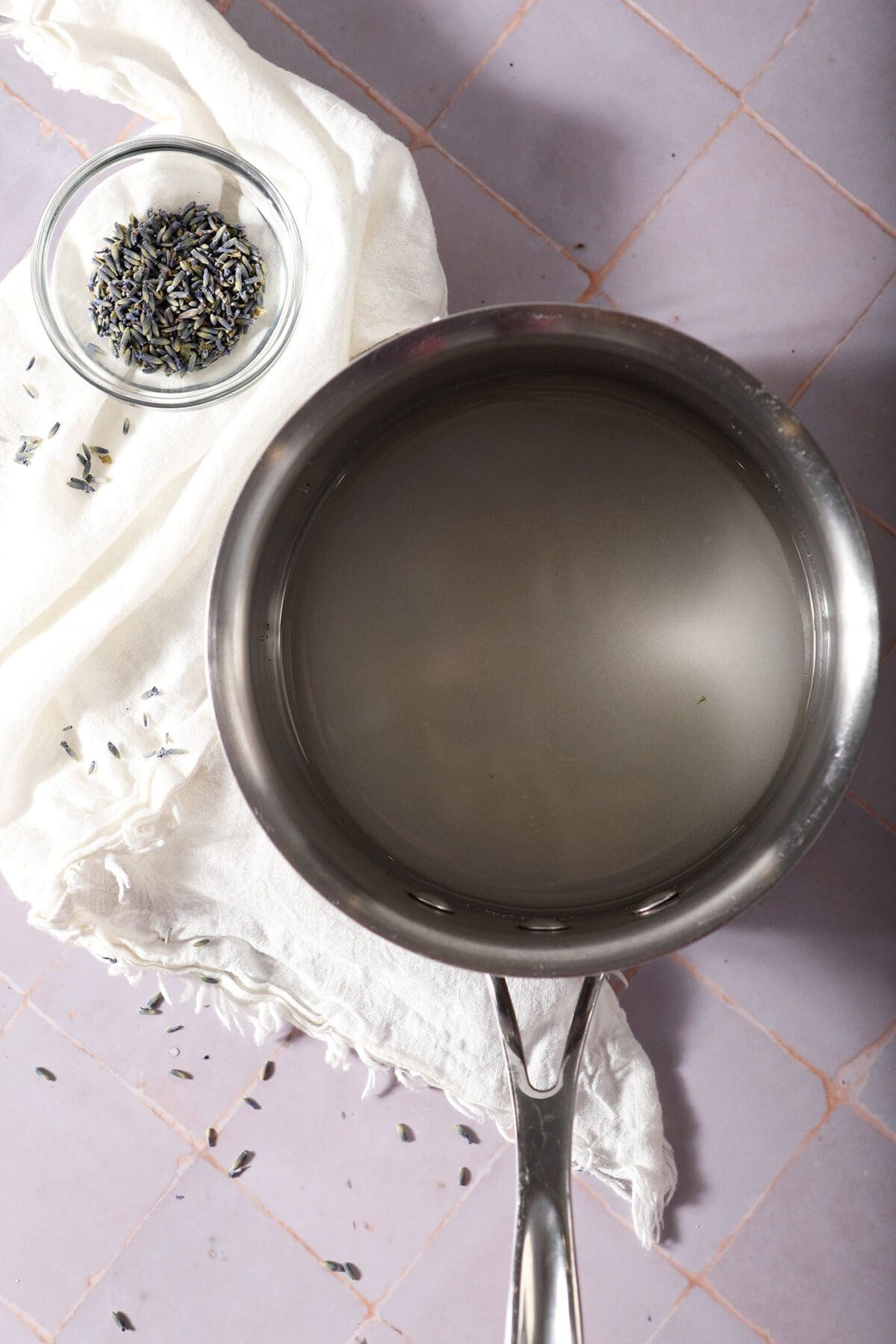 Simple syrup ingredients in a saucepan before boiling